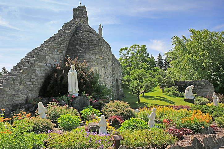 Our Lady of the Woods Shrine | This mountainous structure, "Our lady of the Woods Shrine" is made of stone honeycomb, with niches and sculptures. 